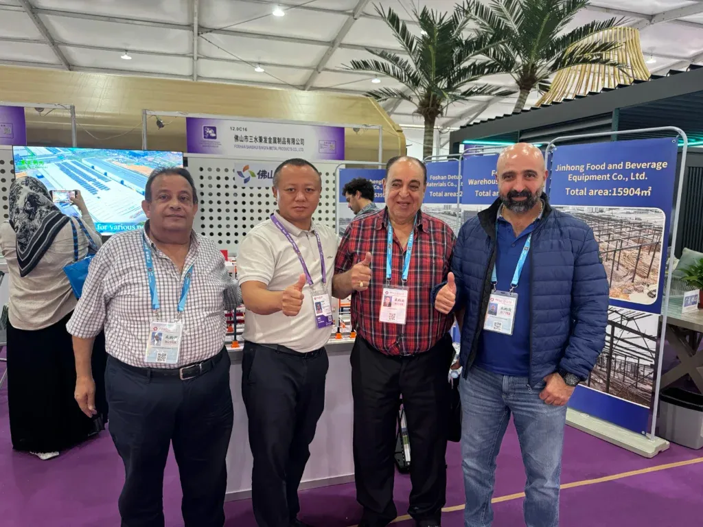 Customers discussing steel structure building projects with Foshan Bingfa