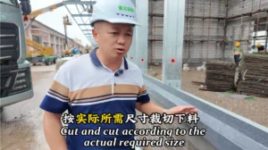 Steel building wall panel installation with sealing edge detail on construction site