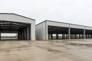 Clear span vs multi-span steel buildings shown in one industrial warehouse complex