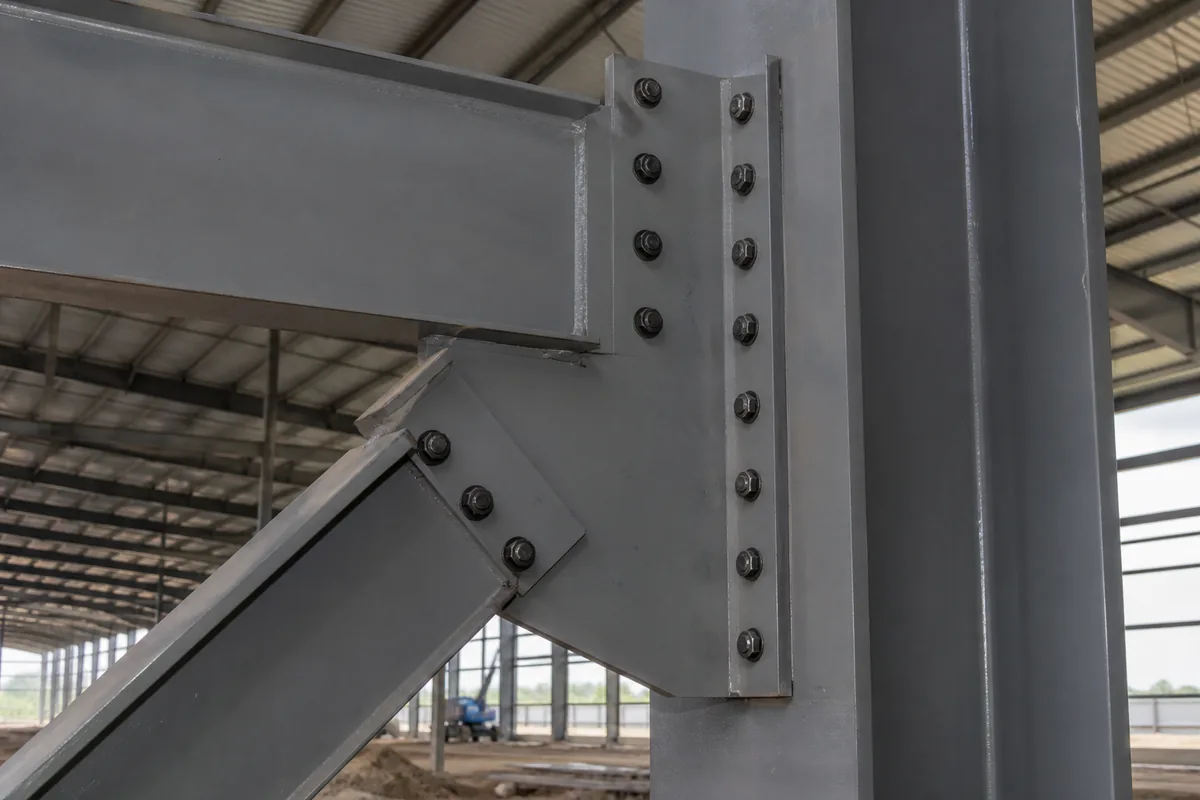 Bolted beam-to-column connection and bracing details in a steel structure building