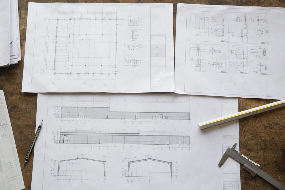Steel building drawings showing the plan elevations and portal-frame sections
