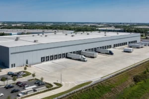 Steel logistics and distribution center with loading docks, trailers and truck court